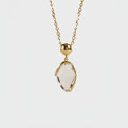 Parure Collier et Boucles d'Oreilles en Quartz Clair Naturel avec Monture en Or · Harmonisez Votre Énergie