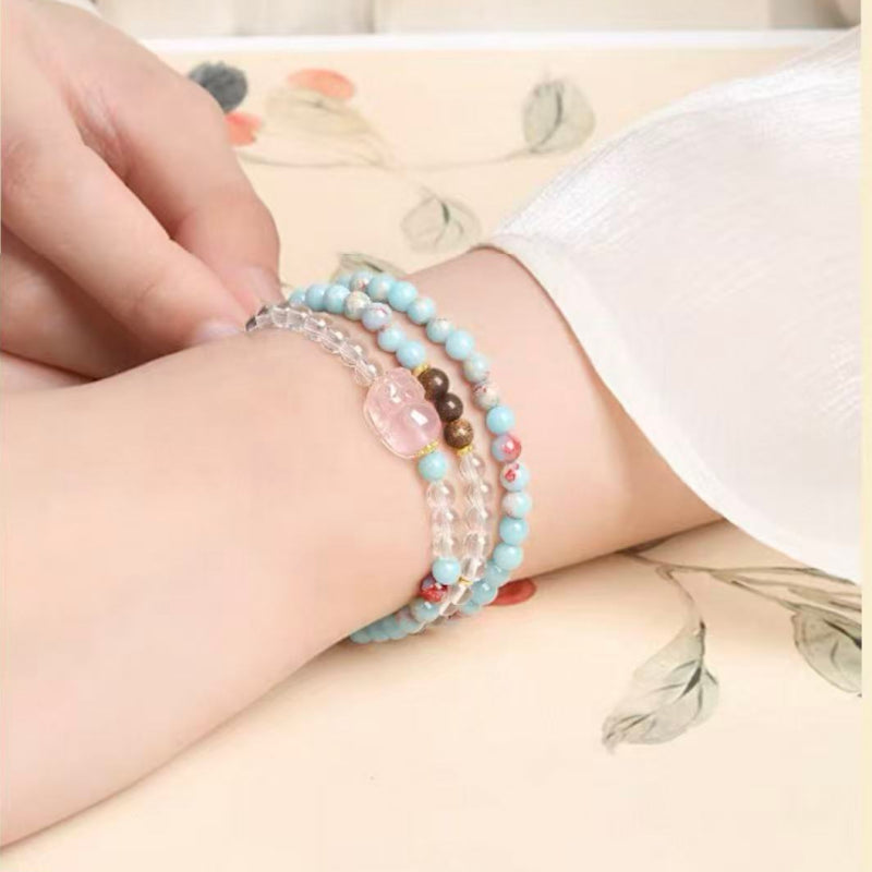 Bracelet triple tour en cristal de rose naturelle