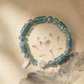 Bracelet de lotus en jadéite orientale avec breloque « Ping An Xi Le » – Bijoux Guochao