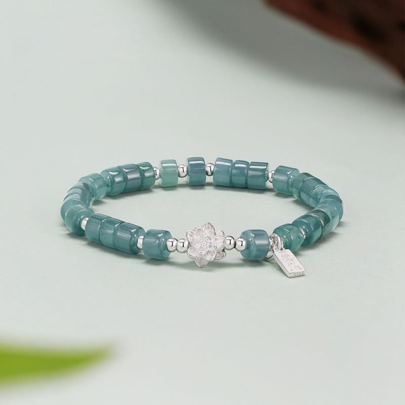 Bracelet de lotus en jadéite orientale avec breloque « Ping An Xi Le » – Bijoux Guochao