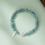 Bracelet de lotus en jadéite orientale avec breloque « Ping An Xi Le » – Bijoux Guochao