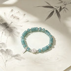 Bracelet de lotus en jadéite orientale avec breloque « Ping An Xi Le » – Bijoux Guochao