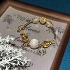 Bracelet avec pendentif cochon doré citrine – Attire la richesse, stimule la carrière, augmente l'abondance