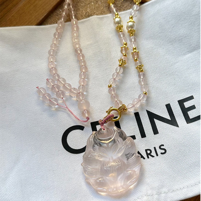 Renard à neuf queues en quartz rose – Charme et protection spirituelle