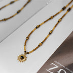 Collier en perles de bois massif et pierre naturelle œil de tigre — Dieu gardien du soleil