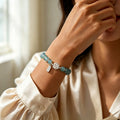 Bracelet de lotus en jadéite orientale avec breloque « Ping An Xi Le » – Bijoux Guochao