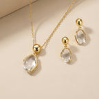 Parure Collier et Boucles d'Oreilles en Quartz Clair Naturel avec Monture en Or · Harmonisez Votre Énergie